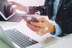 Businessman navigating his secure electronic devices. 