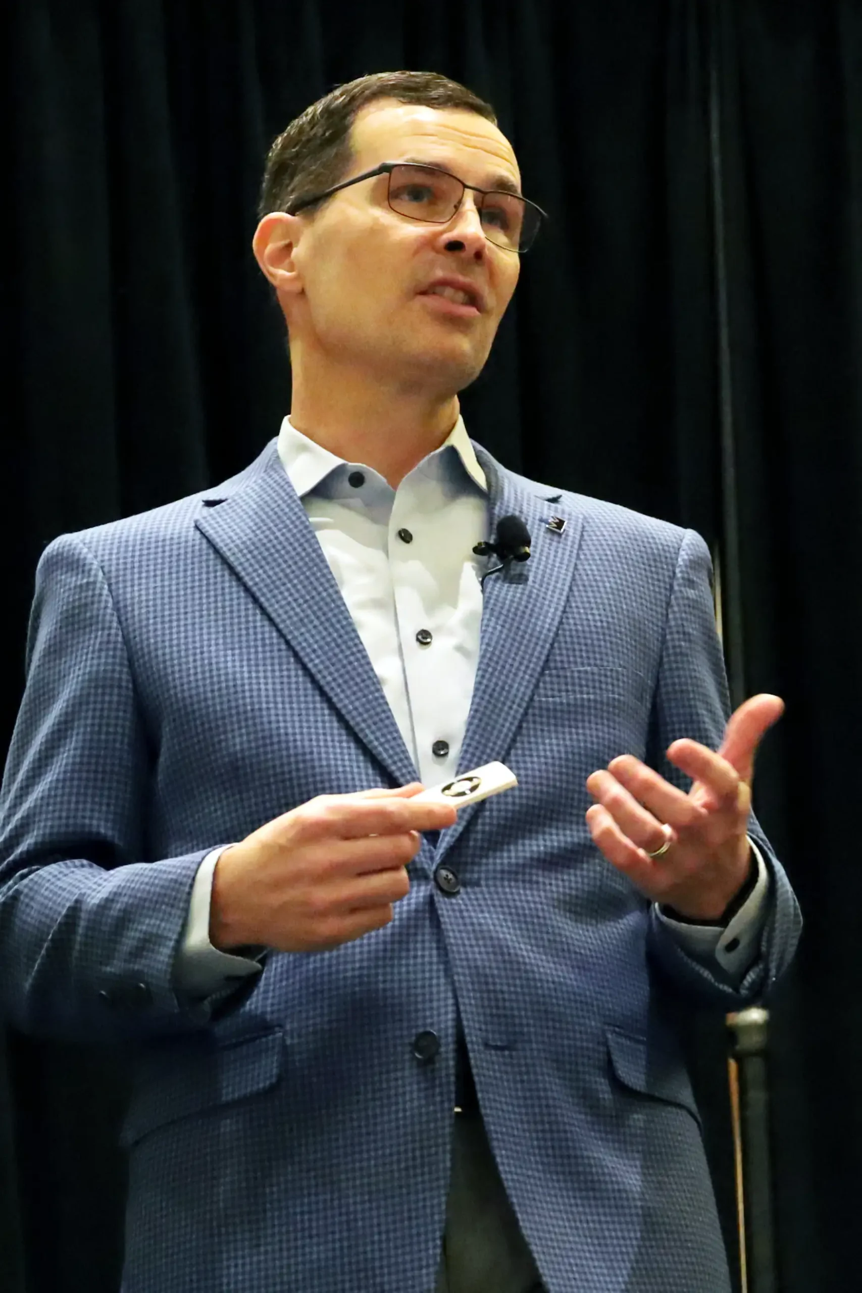 Business Technology Advisor and Speaker, Neal Juern on stage.