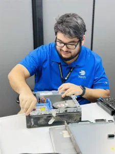 7tech-Service-Tech-Charlie-At-Work copy Service Desk Technician, Charlie Gens working on the inside of a desktop computer.