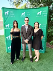 Bella-Neal-Lori-at-ADL-Gala 7tech's CEO Neal Juern, Marketing Director Isabella Humphries, and HR and Accounting Manager Lori Hetletved at Emerald Fur Ball Gala, October 2024.