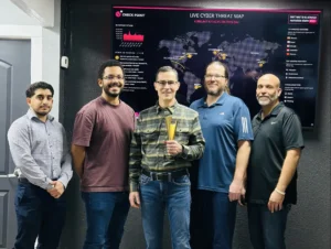 SECOPS-Team-and-Neal-with-MSP-TItan-Award copy 7tech's in-house security operations team at the San Antonio SOC, July 2026.